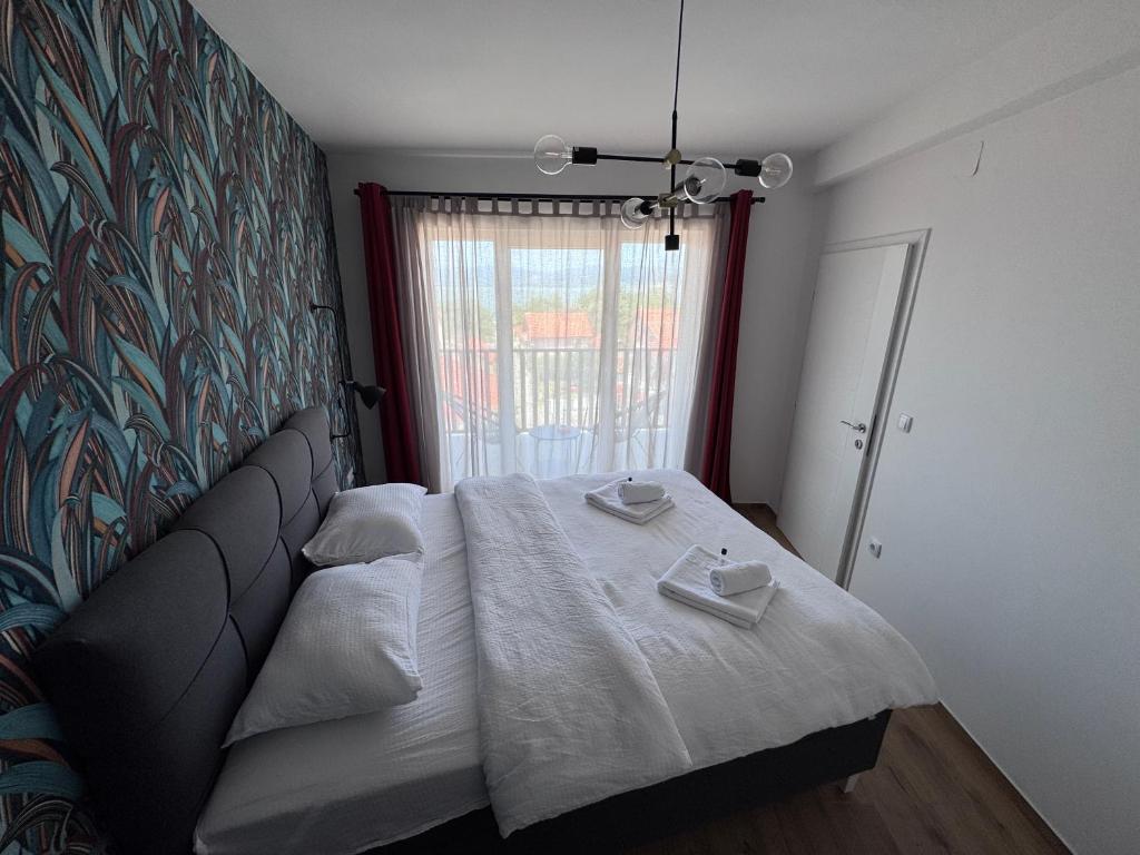 Postel nebo postele na pokoji v ubytování Moms house 2