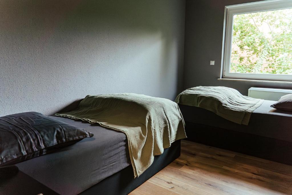 Postel nebo postele na pokoji v ubytování Proud-Apartments Gießen