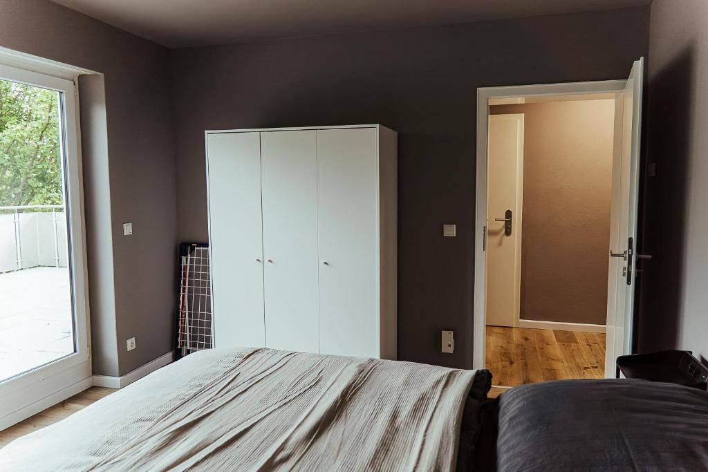 Postel nebo postele na pokoji v ubytování Proud-Apartments Gießen