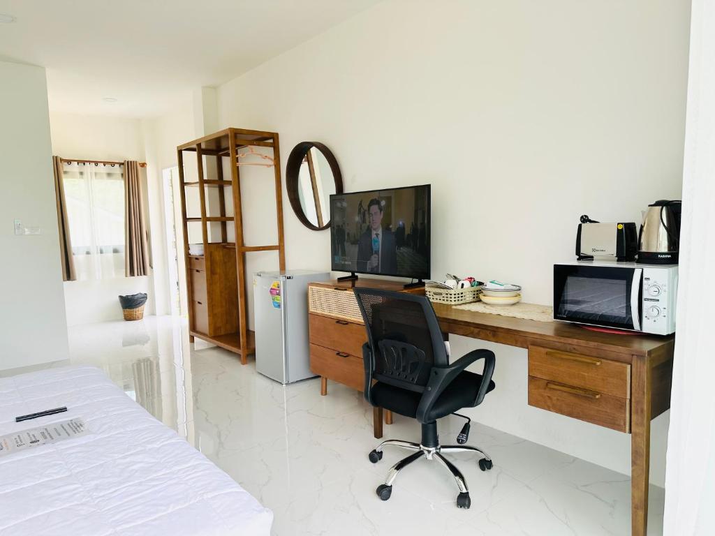 Μια τηλεόραση ή/και κέντρο ψυχαγωγίας στο First Light sunset view bungalow