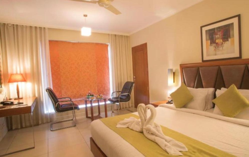 Postel nebo postele na pokoji v ubytování Hotel Diamond Inn-Near IGI -Airport-Terminal-3