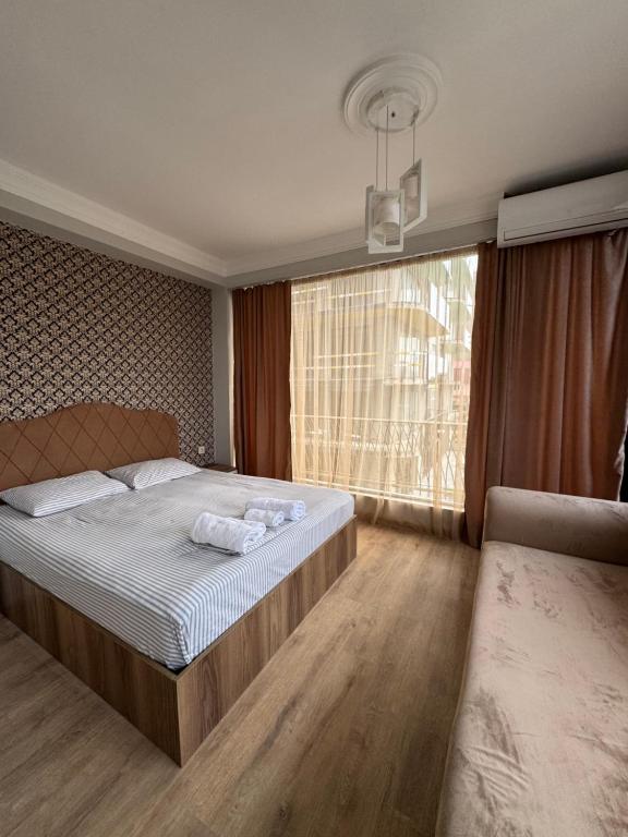 Postel nebo postele na pokoji v ubytování Karo Hotel