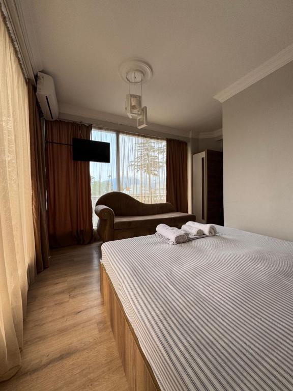 Postel nebo postele na pokoji v ubytování Karo Hotel