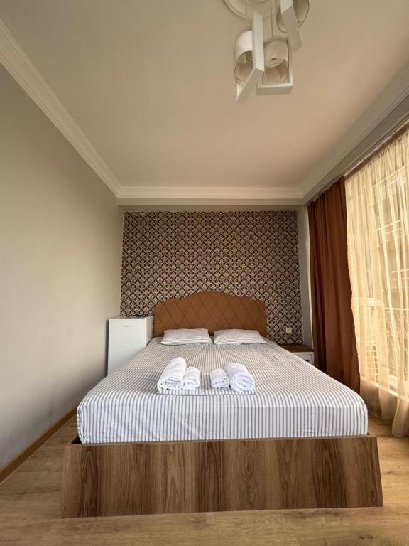 Postel nebo postele na pokoji v ubytování Karo Hotel