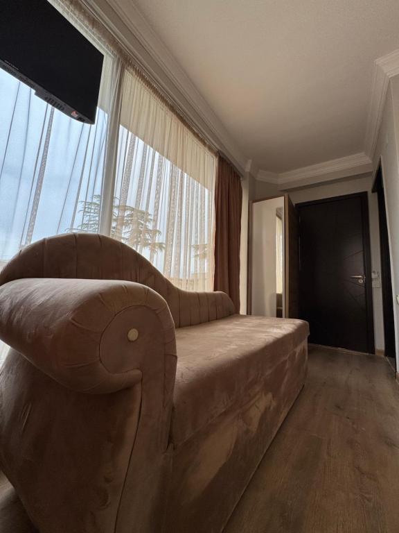 Postel nebo postele na pokoji v ubytování Karo Hotel