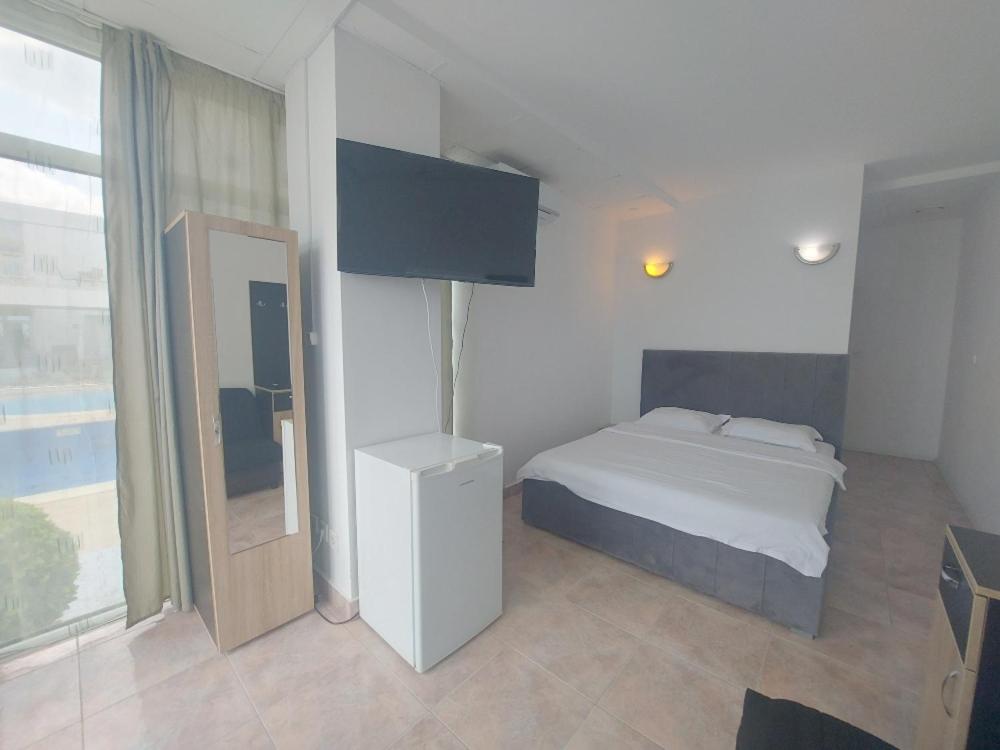 Postel nebo postele na pokoji v ubytování La Perla Bianca Residence
