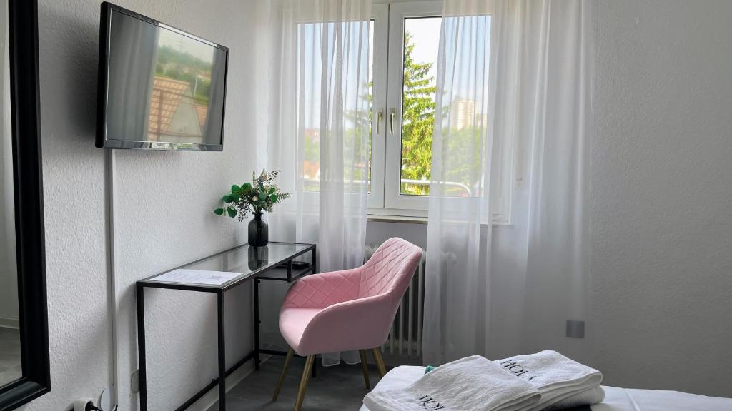 TV a/nebo společenská místnost v ubytování Hola Hotel Stuttgart