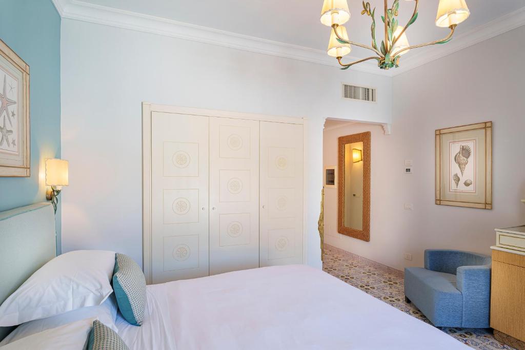 Postel nebo postele na pokoji v ubytování Manzi Hotel & Spa