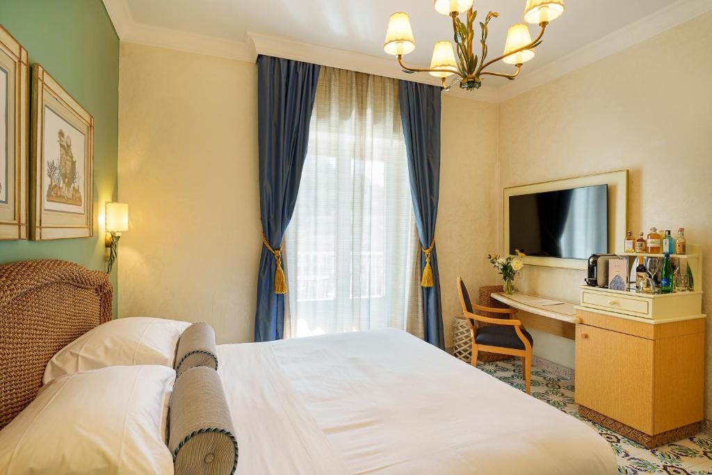Postel nebo postele na pokoji v ubytování Manzi Hotel & Spa