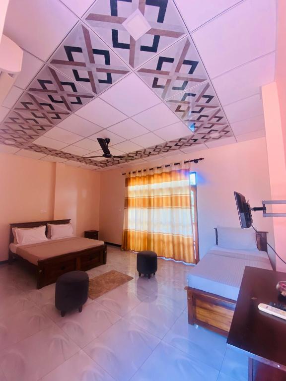 Postel nebo postele na pokoji v ubytování Woodnest Saayoo Resort