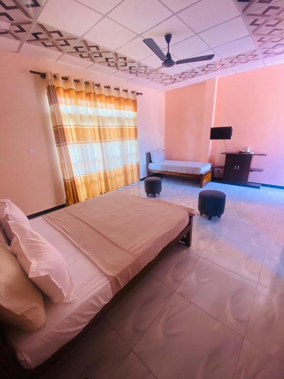 Postel nebo postele na pokoji v ubytování Woodnest Saayoo Resort