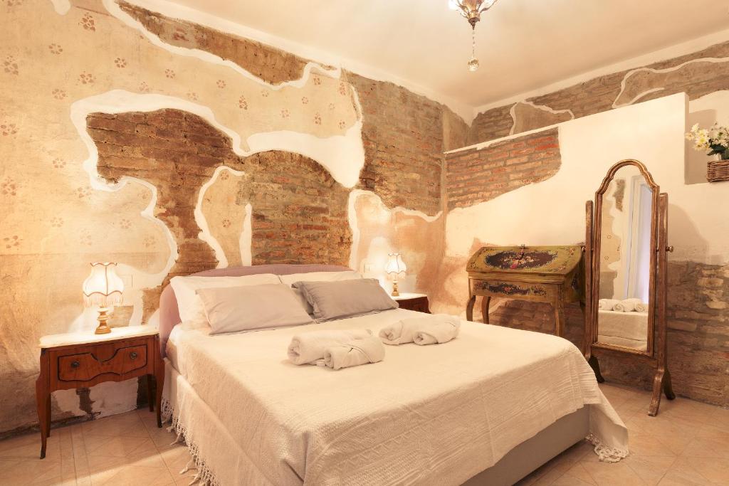 Postel nebo postele na pokoji v ubytování Il Castello delle dame - Lo Scudiero