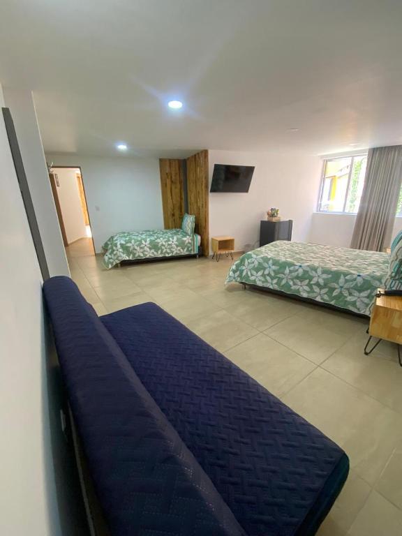 Postel nebo postele na pokoji v ubytování BISÁU Hotel