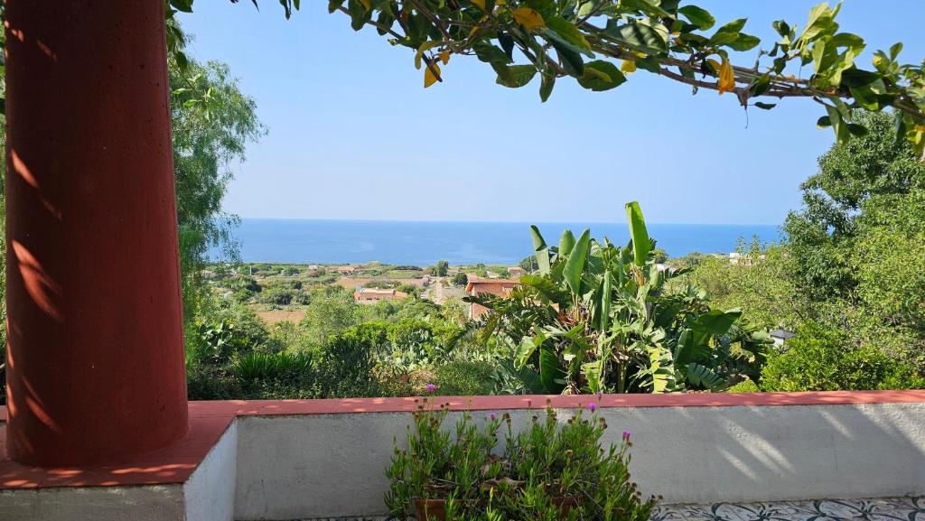 a view of the ocean from the porch of a house at Terranova 