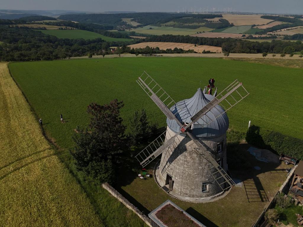 an aerial view of a windmill in a field at Holländermühle Tultewitz 