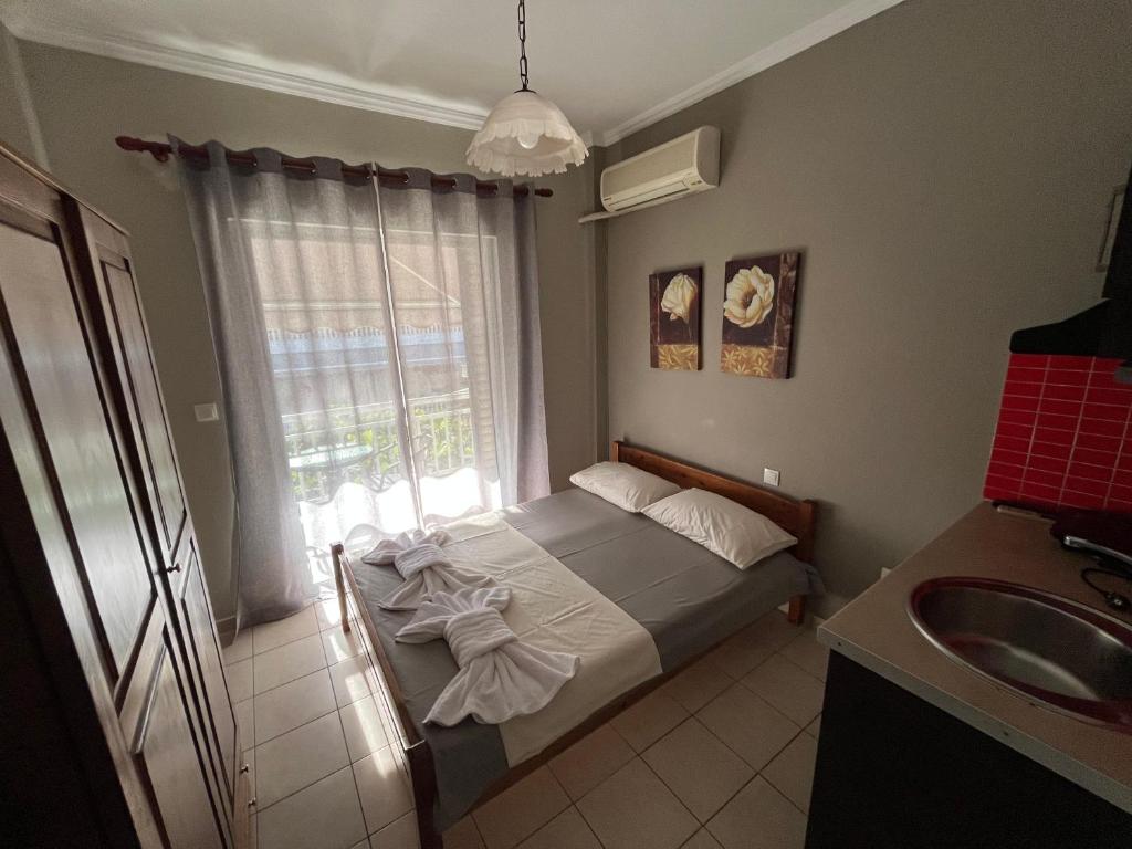 Postel nebo postele na pokoji v ubytování Nopi Rooms
