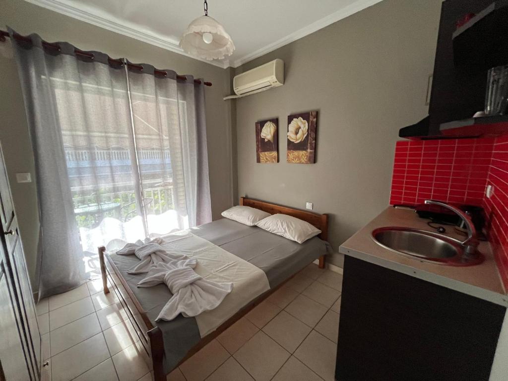 Postel nebo postele na pokoji v ubytování Nopi Rooms