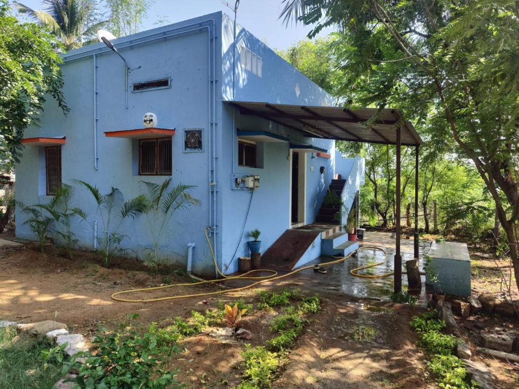 a house being constructed with a house at RICHVINU HOME sTAY in Madurai