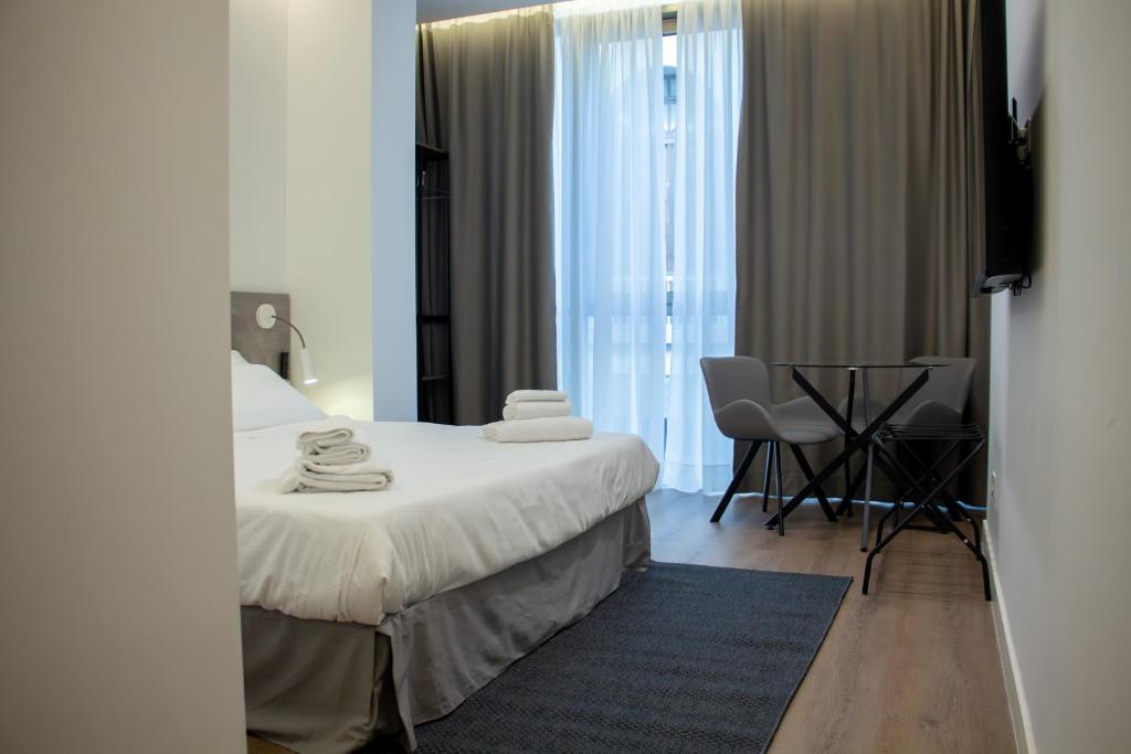 Ένα ή περισσότερα κρεβάτια σε δωμάτιο στο Central Promenade