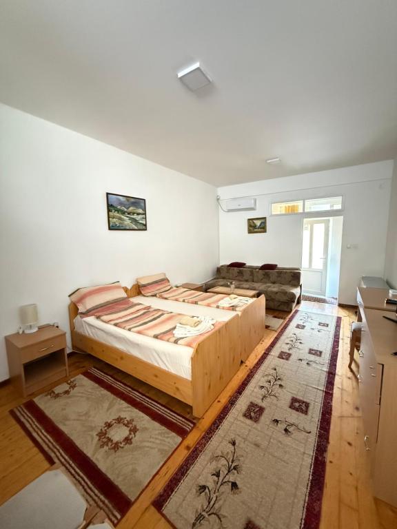 Postel nebo postele na pokoji v ubytování Apartman Nikola VB