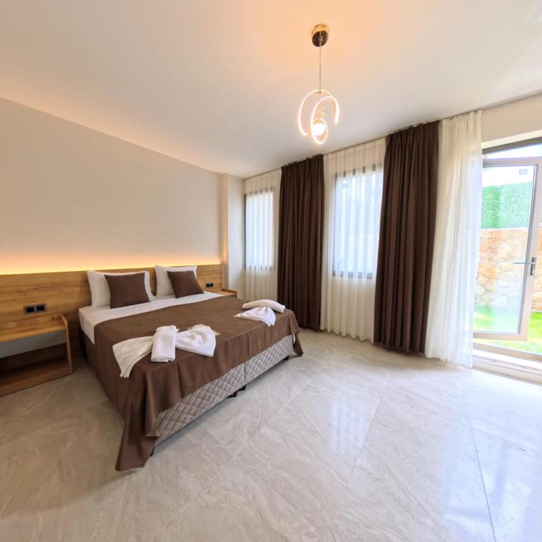 Postel nebo postele na pokoji v ubytování Naturalis Pamukkale Otel