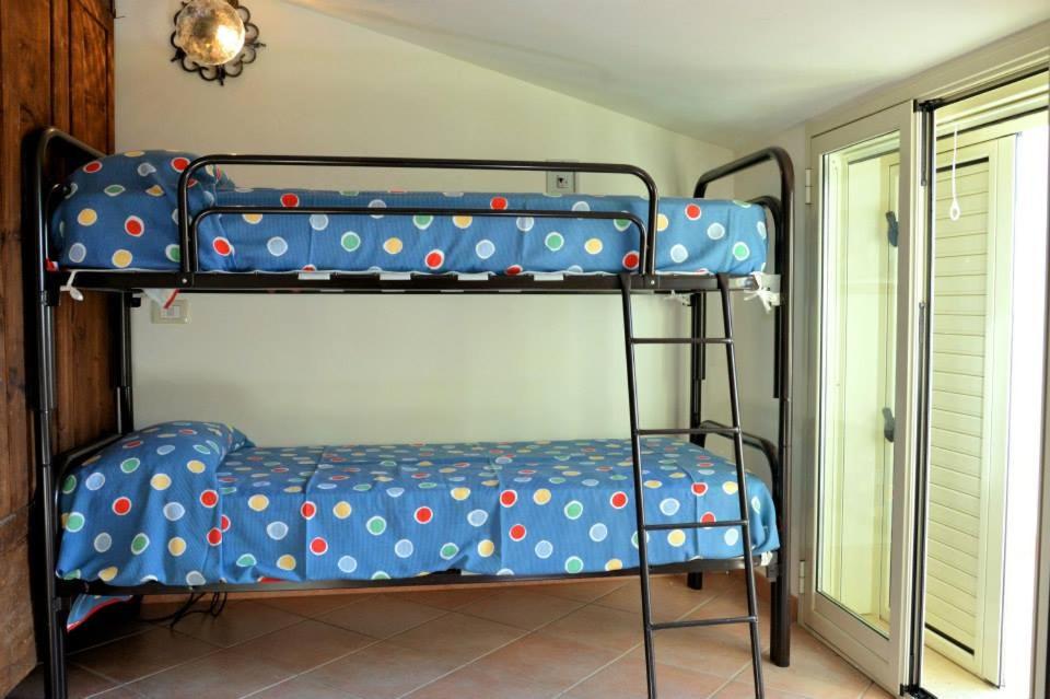 Postel nebo postele na pokoji v ubytování Sovareto Mare