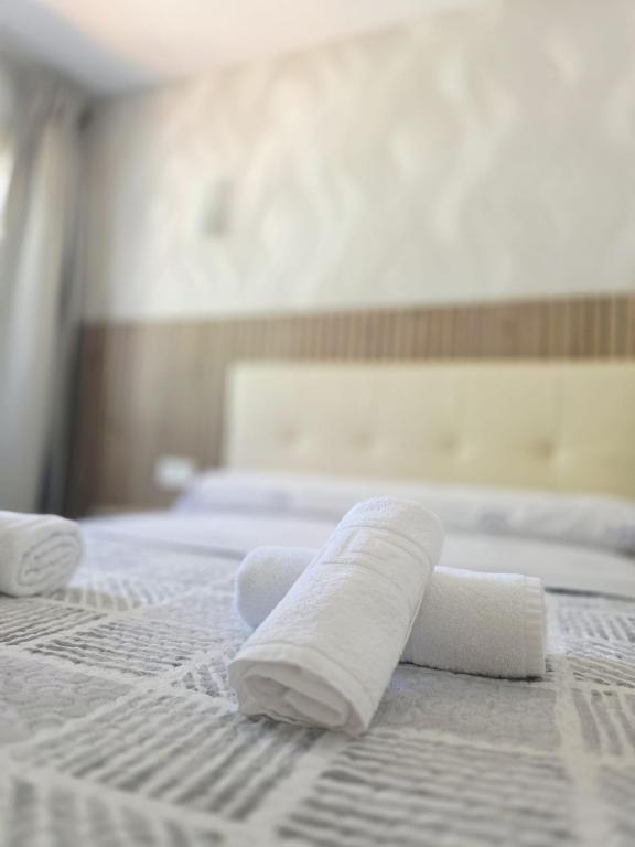 A bed or beds in a room at Apartamento calle de la Cordera, 3