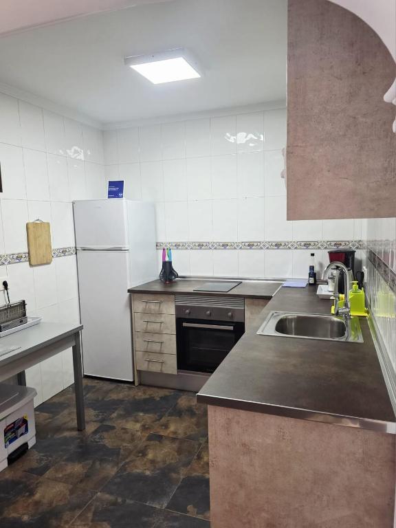 A kitchen or kitchenette at Apartamento calle de la Cordera, 3