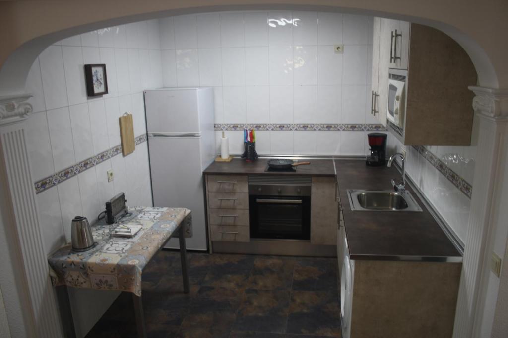 A kitchen or kitchenette at Apartamento calle de la Cordera, 3