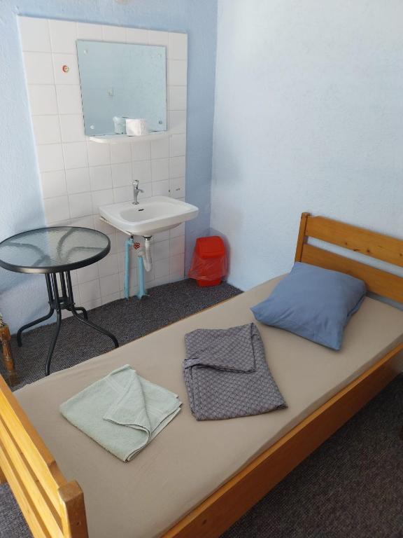 Postel nebo postele na pokoji v ubytování Complex DUNAREA Saturn