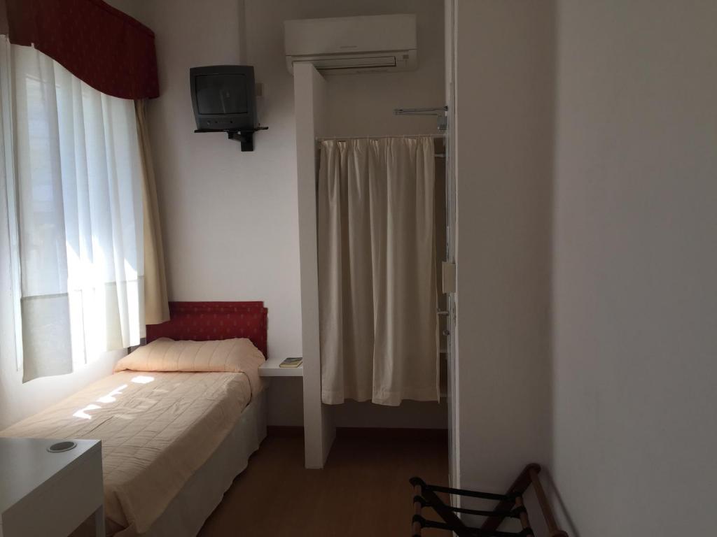 Posteľ alebo postele v izbe v ubytovaní Hotel Marlisa Pier