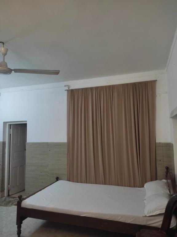 Postel nebo postele na pokoji v ubytování New Araliya Resort