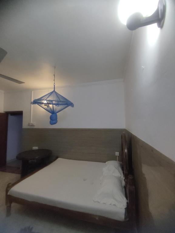 Postel nebo postele na pokoji v ubytování New Araliya Resort