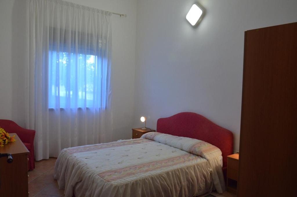 Postel nebo postele na pokoji v ubytování Sovareto Mare