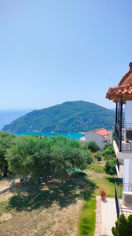 a view of the ocean from a balcony of a building at Studios Evgenia Parga in Parga