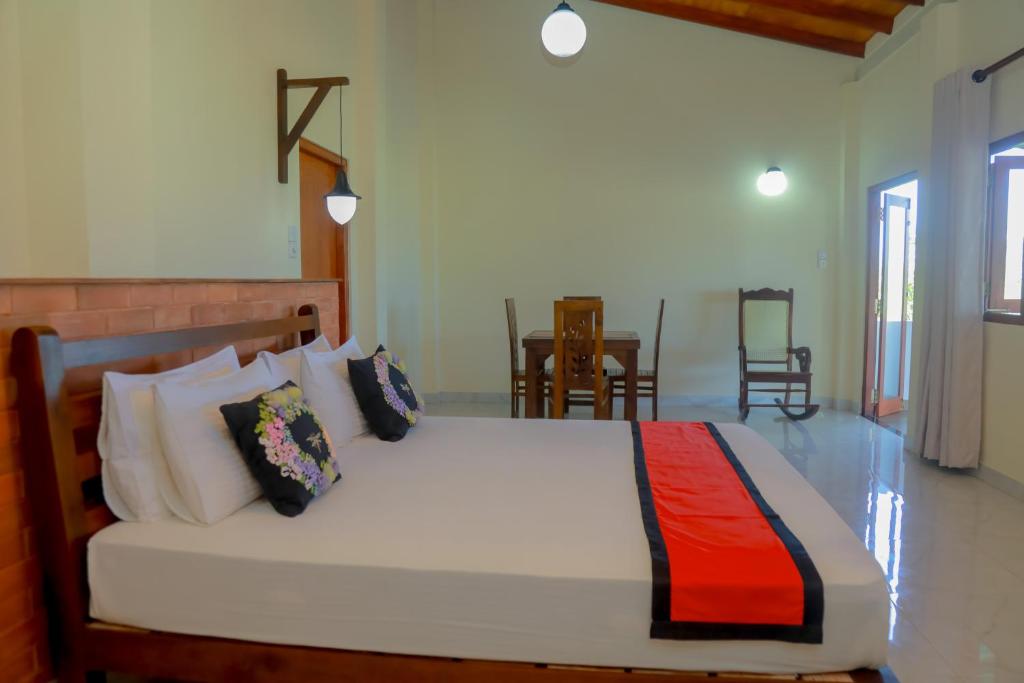 Postel nebo postele na pokoji v ubytování Athithi Villa