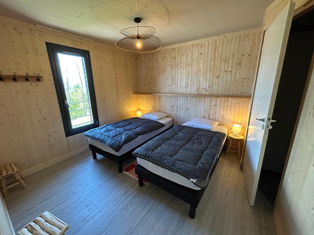 Postel nebo postele na pokoji v ubytování Domaine Napoléon