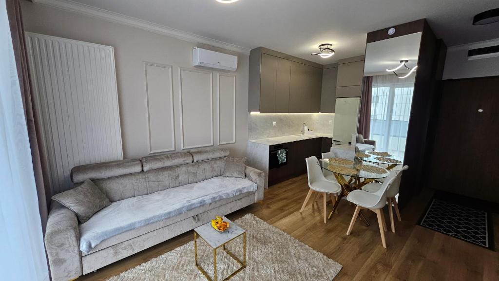 a living room with a couch and a table at RentiStok - Apartament w Centrum in Białystok