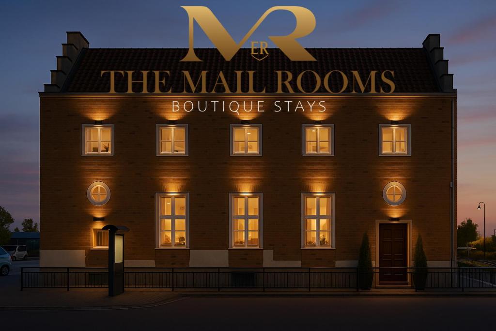 a building with a sign that reads the naughons boutique stays at The Mail Rooms Limavady - Boutique Stays in Limavady
