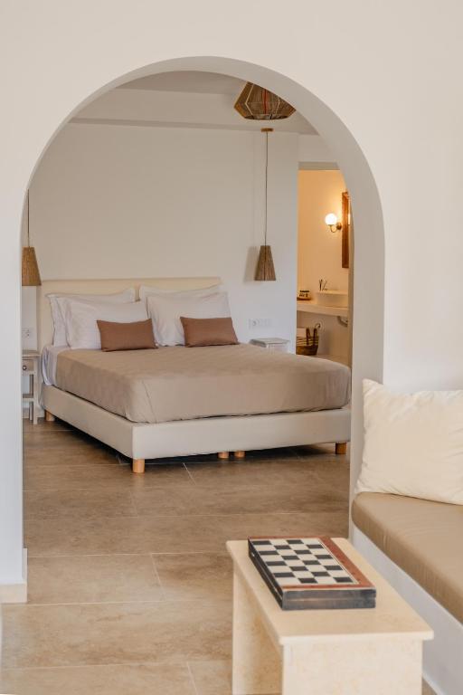 a bedroom with a bed and a chess board on a table at VERANNA Patmos D2 in Patmos