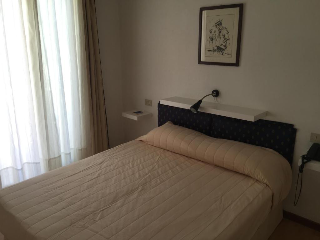 Posteľ alebo postele v izbe v ubytovaní Hotel Marlisa Pier