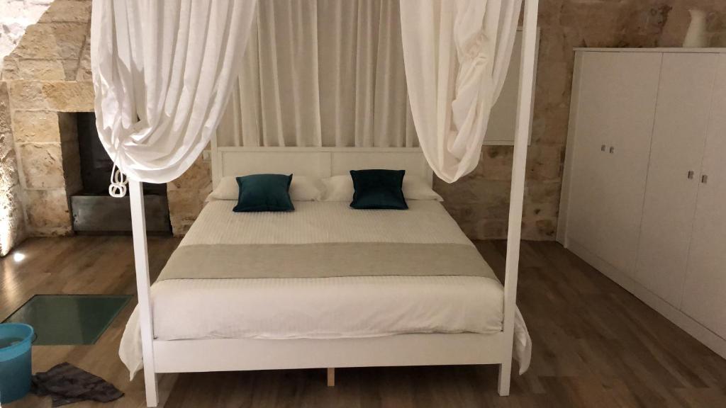 Postel nebo postele na pokoji v ubytování B&B Aurelia