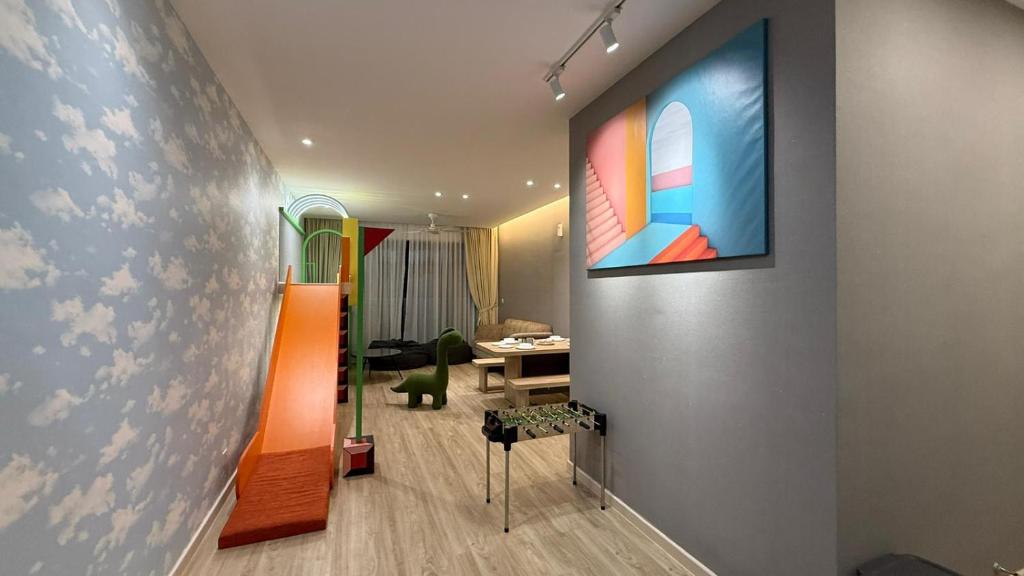 a living room with a painting on a wall at Legoland-JB Medini Luxury Play & Stay 5pax in Iskandar Puteri