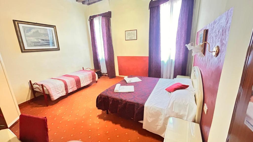 Uma cama ou camas num quarto em Casa Lin Venice Zimmer
