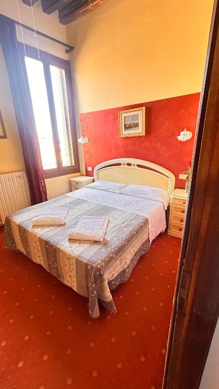Uma cama ou camas num quarto em Casa Lin Venice Zimmer