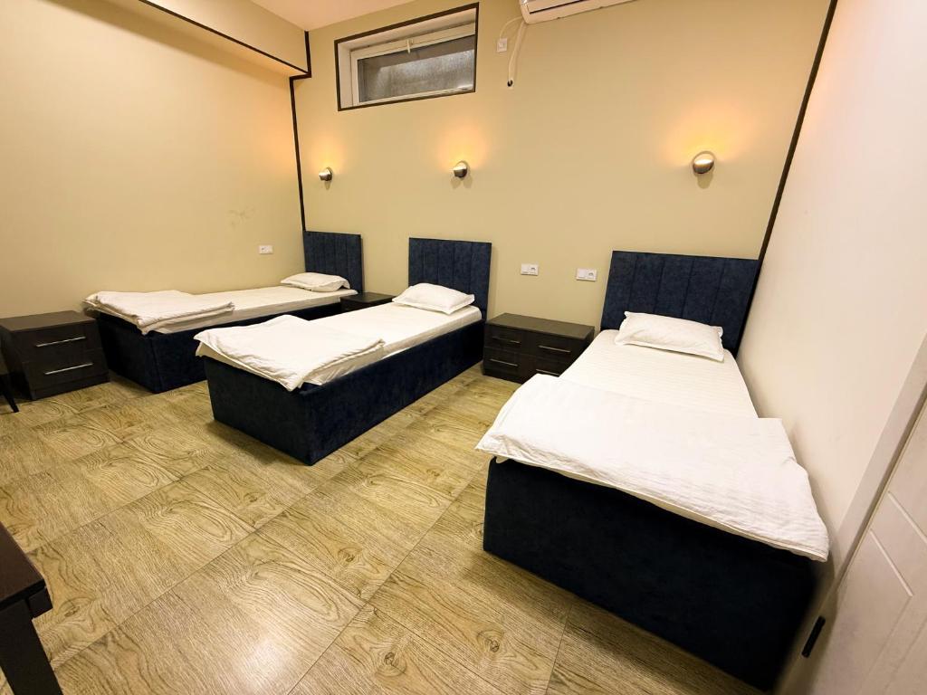Grand Horizon Hotel - Deluxe Dreibettzimmer