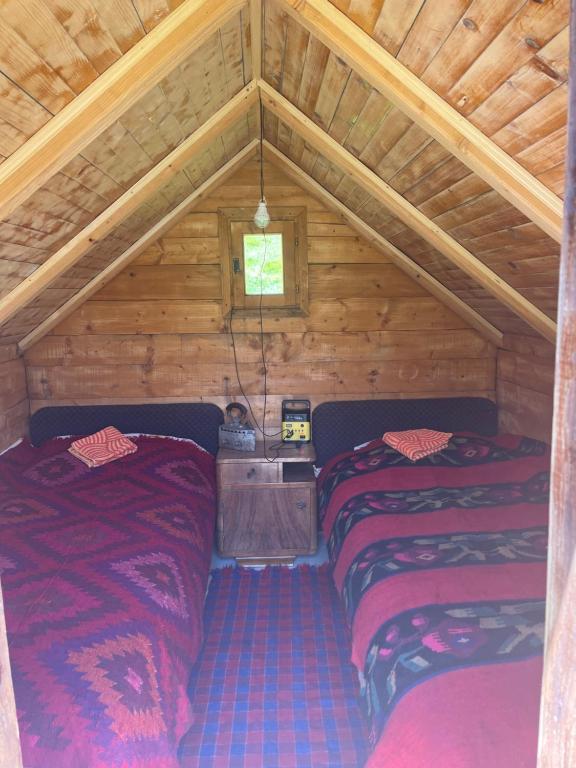 Postel nebo postele na pokoji v ubytování Eko Katun Kolijevka