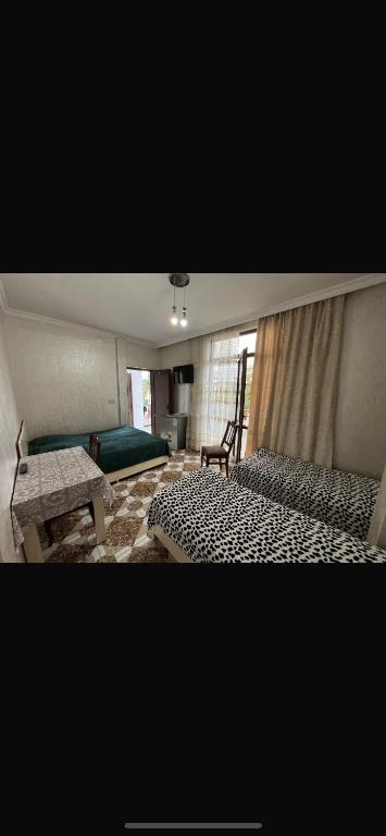 Postel nebo postele na pokoji v ubytování FIROSMANI house