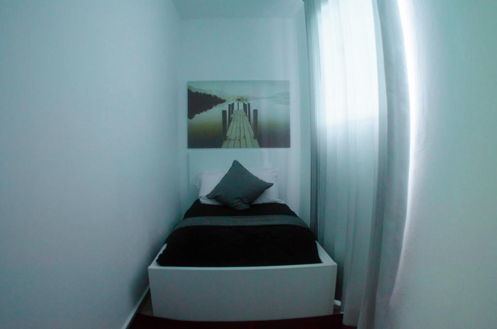 Postel nebo postele na pokoji v ubytování Hotel Casa Jum