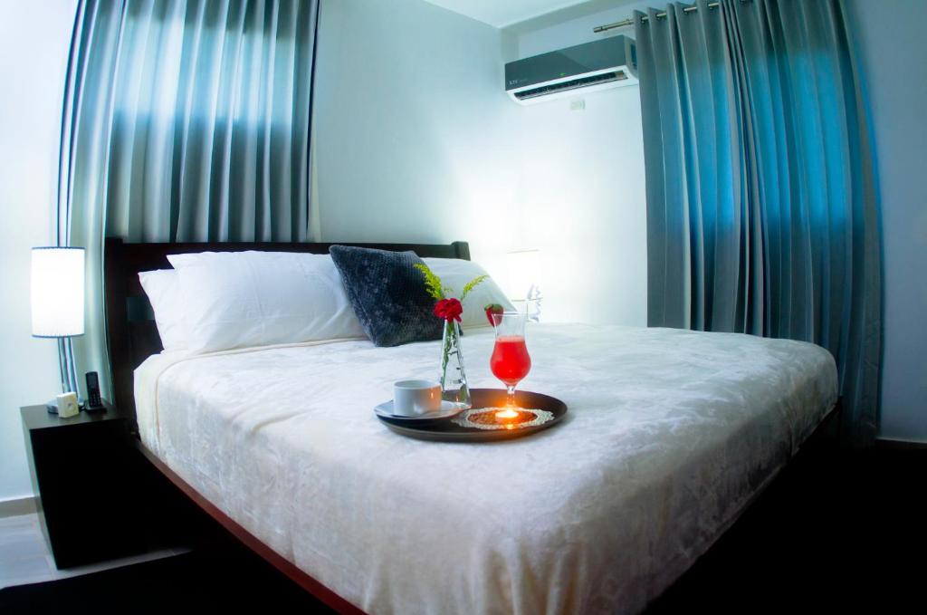 Postel nebo postele na pokoji v ubytování Hotel Casa Jum
